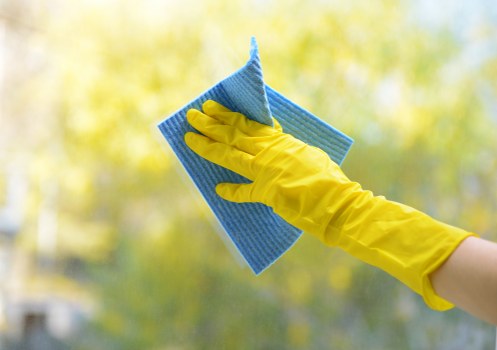 Carpet cleaners preparing equipment with safety awareness