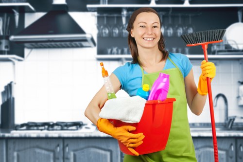 Professional carpet cleaners following health and safety procedures