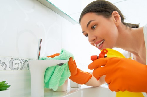 Cleaning staff managing a carpet cleaning task with caution